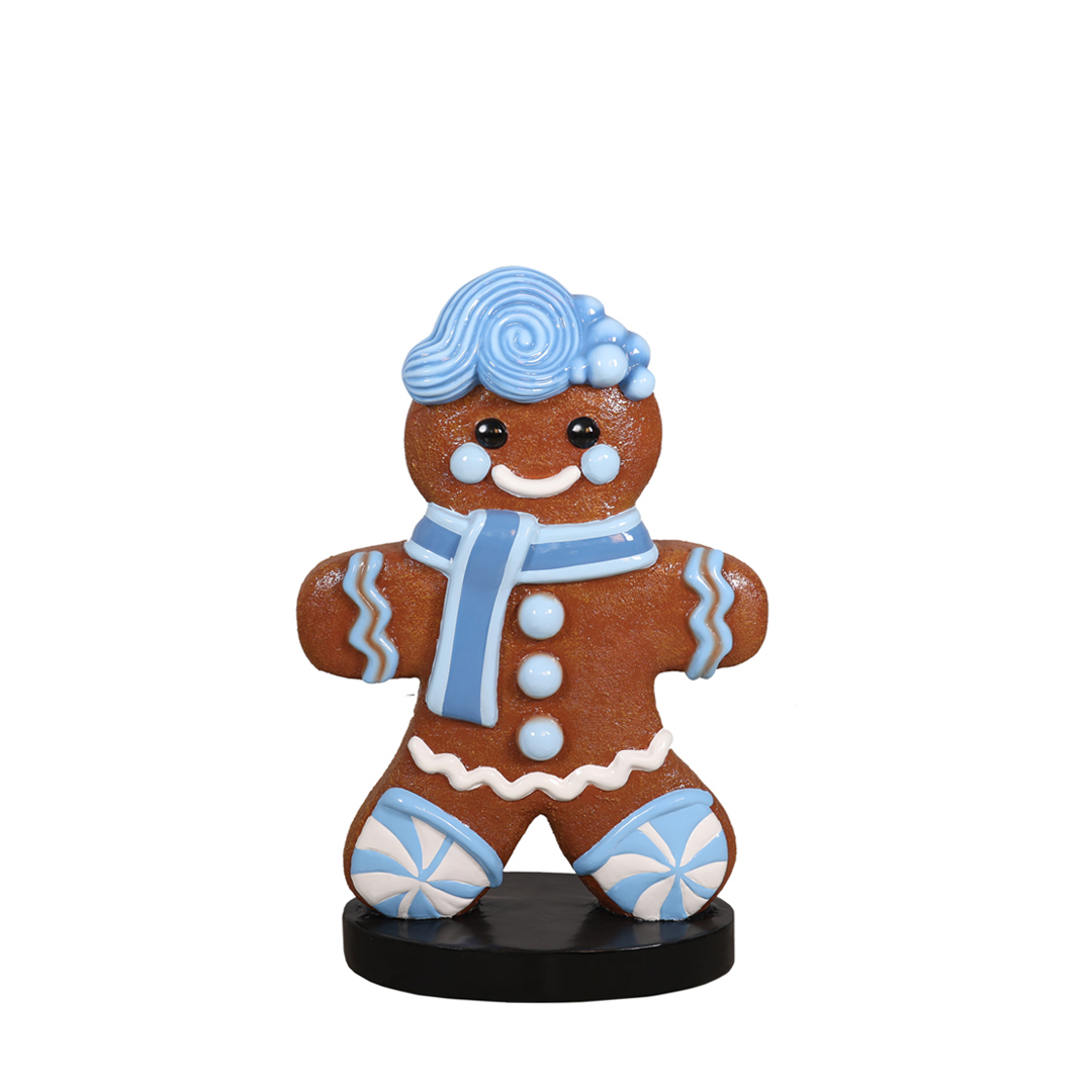 Blue Boy gingerbread character with pale blue icing and scarf